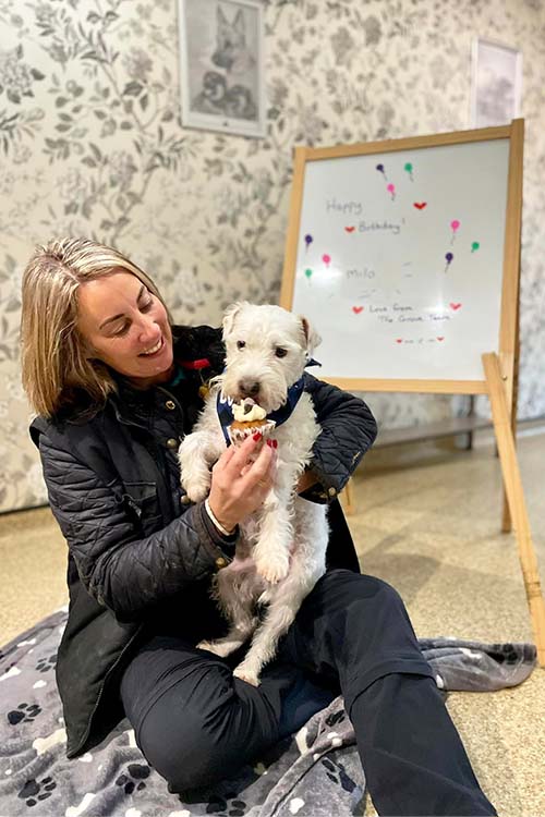 Lindsay with Milo having a birthday pupcake